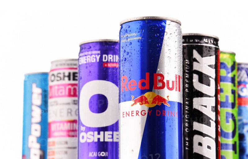 POZNAN, POLAND - JULY 27, 2017: Cans of popular global energy drinks, beverages containing stimulant drugs and marketed as providing mental and physical stimulation