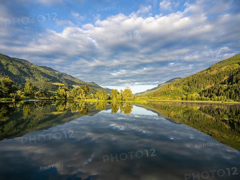 Clouds are reflected in the lake, Gaishorner See in the evening light, Gaishorn am See, Paltental, Styria, Austria, Europe
