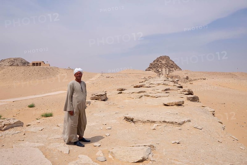 Man in front of funerary temple, pyramid of Pharaoh Sahure, Abusir, Egypt, Africa