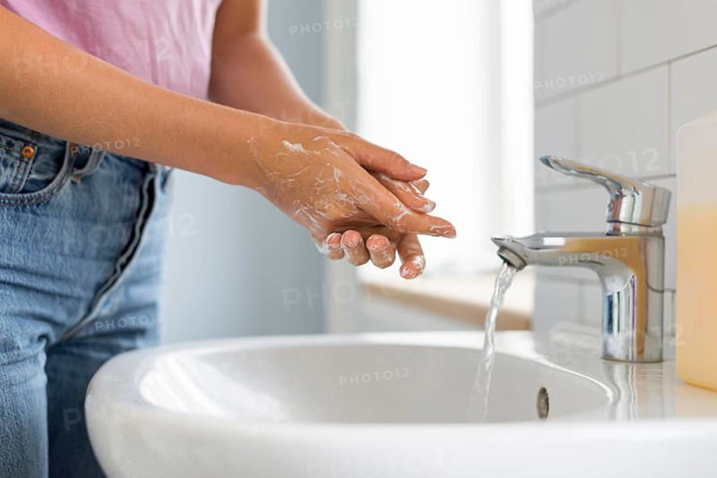 Close up woman washing her hands