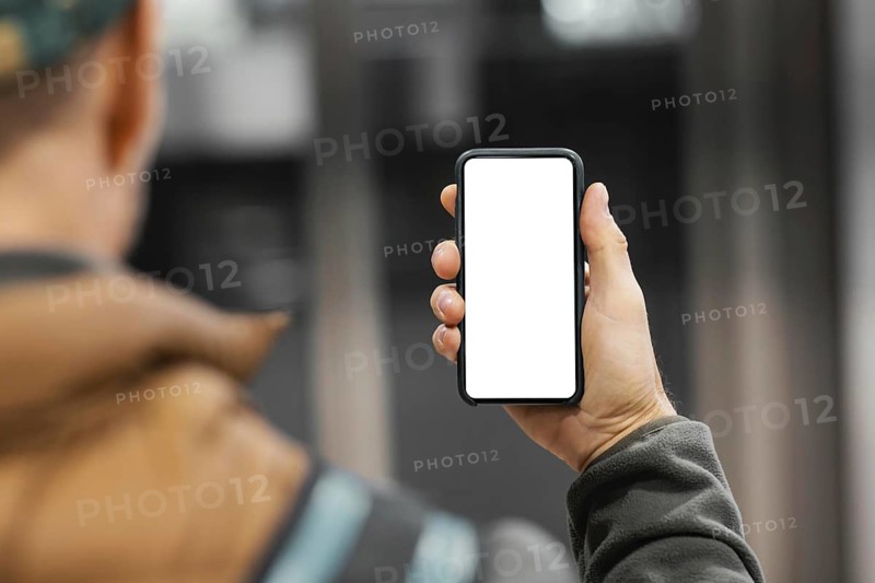 Delivery man with package elevator with mobile. High resolution photo