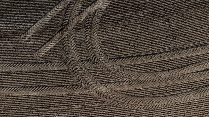 Tractor tyre tracks form an interesting pattern on a freshly cultivated field without vegetation, drone image, Upper Bavaria, Bavaria, Germany, Europe