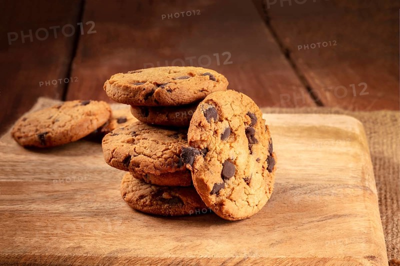 Chocolate chip cookies, gluten free, a close-up of a stack on a dark rustic background