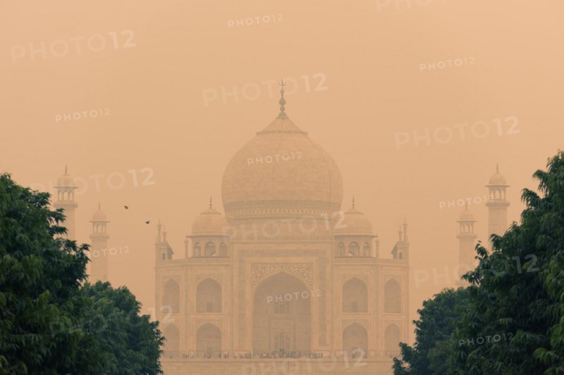 The backside of the Taj Mahal in Agra, India on overcast day with smog