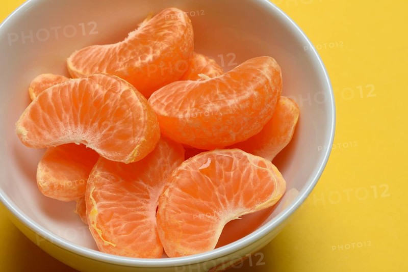 Clementine pieces in peel, citrus fruit
