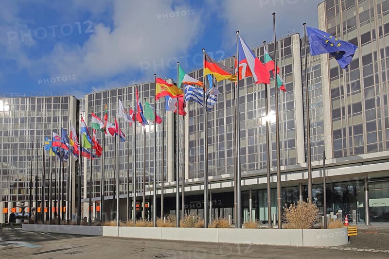 Modern building Winston Churchill with row of European national flags, state flag, European, EU flag, modern building, glass building, glass windows, politics, international, EU Parliament, Strasbourg, Bas-Rhin, Alsace, France, Europe