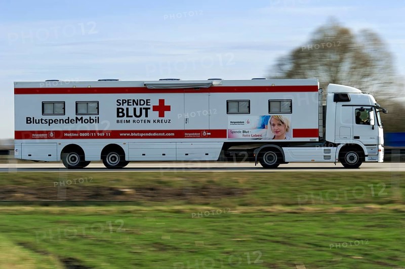 Truck, lorry, articulated lorry, Blutspende Mobil, donate blood, blood donation service, German Red Cross driving fast on the A92 motorway, motion blur, wipe effect, Freising, Upper Bavaria, Bavaria, Germany, Europe