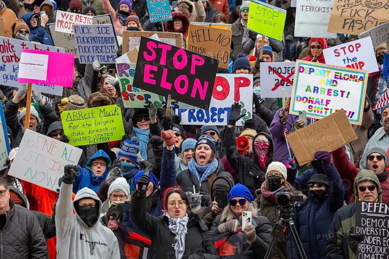 Lansing, Michigan USA - 5 February 2025 - People rally at the Michigan state capitol to oppose President Trump, Elon Musk, and Project 2025. Similar rallies were planned across the country, many of them at state capitols