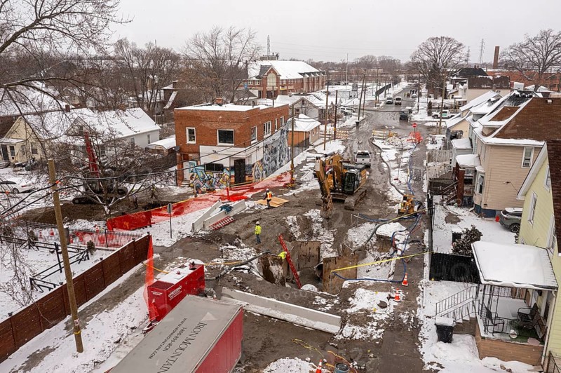 Detroit, Michigan - Workers repair a water main break that flooded streets and homes in southwest Detroit. The 54-inch pipeline that failed dates to the 1930s