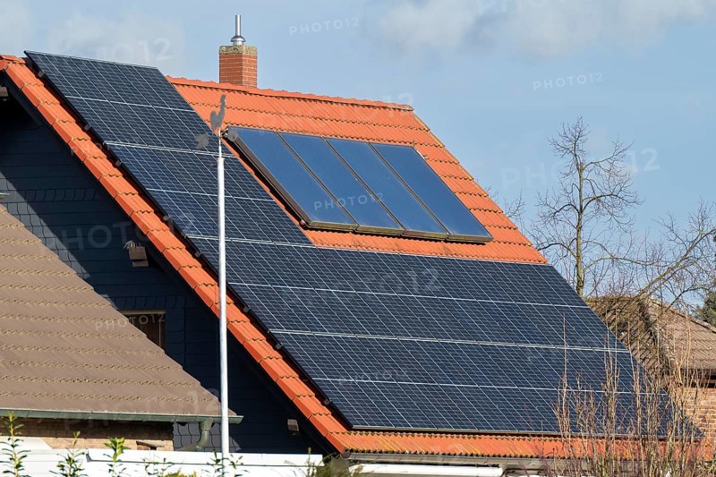 Weathercock in front of a house roof with photovoltaics, Kamen, North Rhine-Westphalia, Germany, Europe