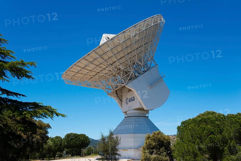 ESA's large radio telescope under a clear blue sky, surrounded by green trees, for scientific use, European Space Astronomy Centre, Villafranca del Castillo, Madrid, Spain, Europe