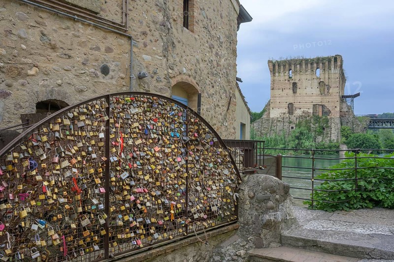 Love locks by an old mill wheel, Borghetto, Valeggio sul Mincio, Province of Verona, Italy, Europe