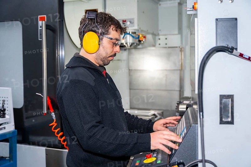 Factory worker who made the necessary coding in CNC modern machine