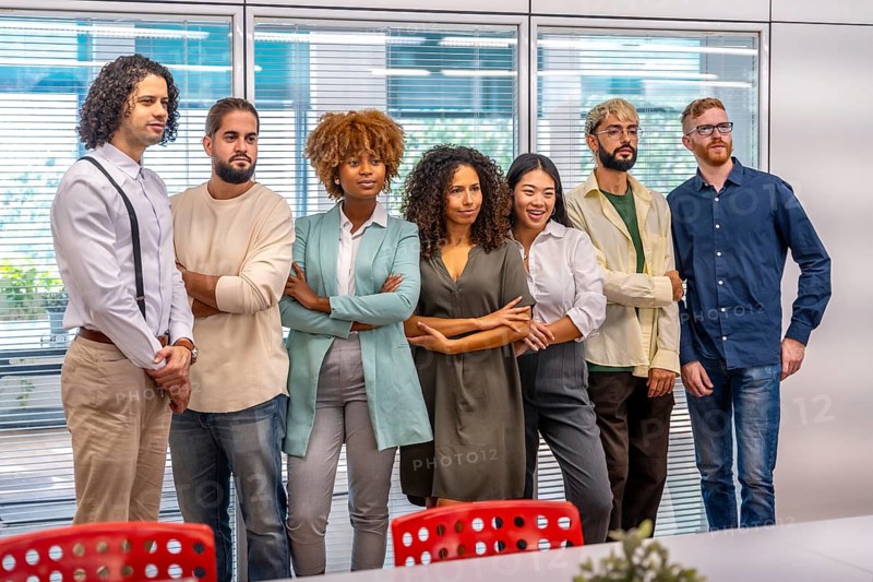 Portrait of a serious team of young and multiracial cowokers standing in the office