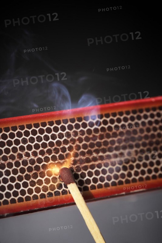 Striking a match against a match box