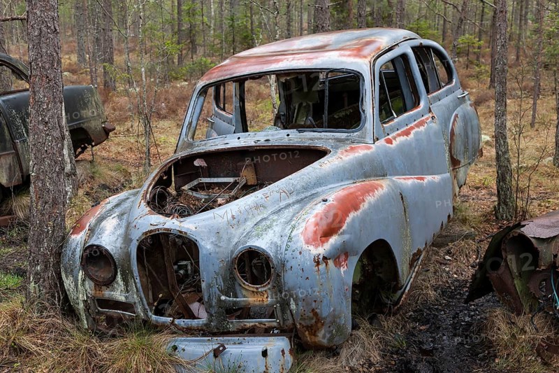 Old car wreck in the car cemetery of Kyrkoe Mosse, Ryd, Tingsryd, Kronoberg County, Sweden, Europe