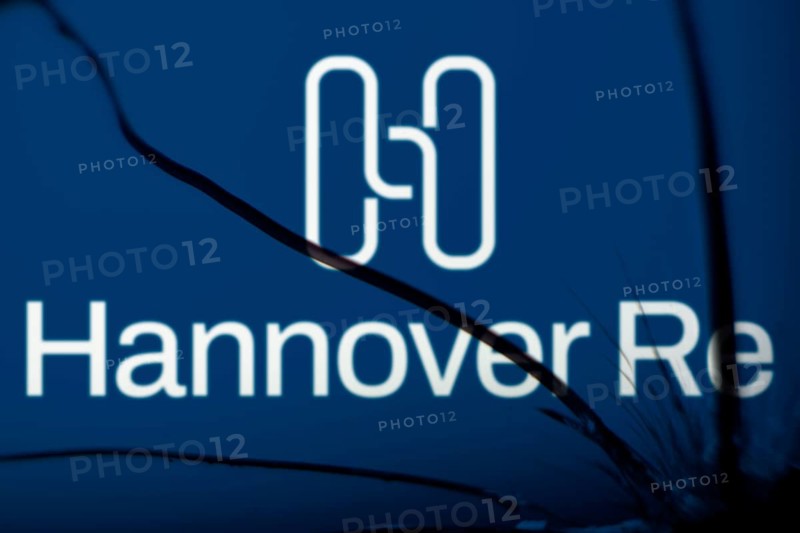 Hannover re logo is visible on the broken glass. Hannover Re is a reinsurance company