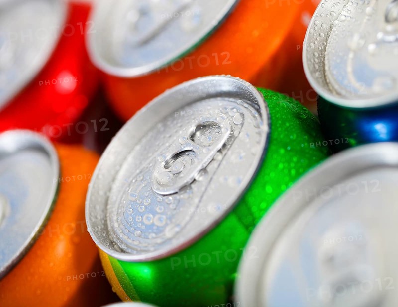 Cans of sweet drinks (or beer) . Cooling frozen and with water drops