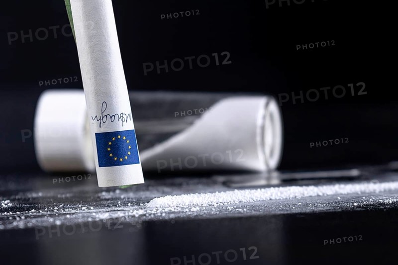 Cocaine Sniffing Closeup, Rolled Banknote for Snorting Line of Cocaine, Cocaine Drug Addiction