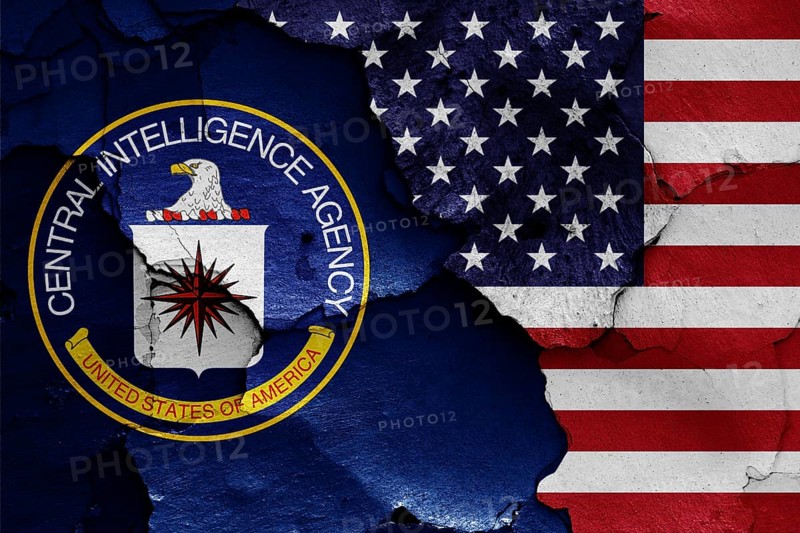Flags of Central Intelligence Agency and USA painted on cracked wall