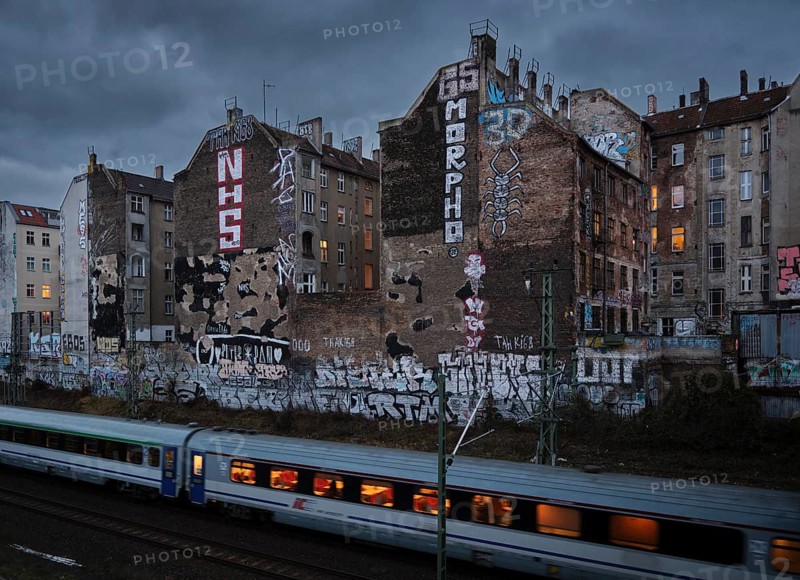 Germany, Berlin, 17.12.2024, View from Schönfließer Brücke, rear building gable Kopenhagener Straße, regional train, Europe