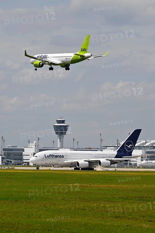 Lufthansa Airbus A380-800 with control tower waiting for take-off clearance for southern runway with landing Air Baltic Airbus A320, Munich Airport, Upper Bavaria, Bavaria, Germany, Europe