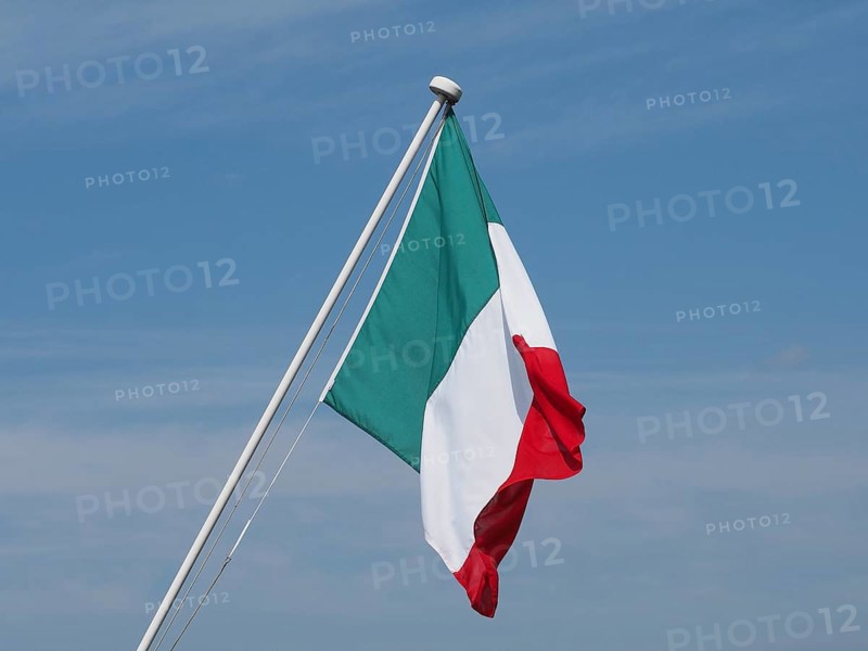 Italian Flag of Italy over blue sky