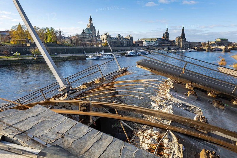 Partial collapse of the Carola Bridge. Over a length of around 100 metres, the section on which the trams normally run has collapsed into the Elbe. The demolition of the section is in full swing. Dresden, Saxony, Germany, Europe