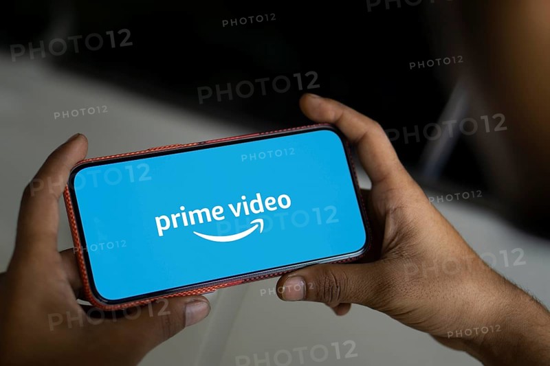Amazon prime video logo is displayed on smartphone.