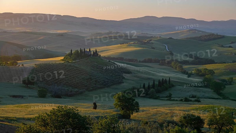 Val d'orcia, rolling hills with cypress trees at sunrise, landscape, tuscany, italy