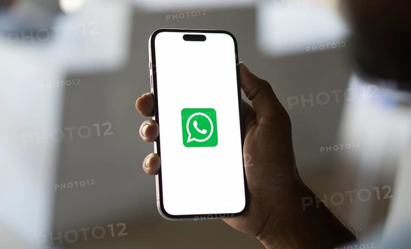 Man holding a cellphone with WhatsApp on the screen.Dhaka, Bangladesh- 09 September 2024.