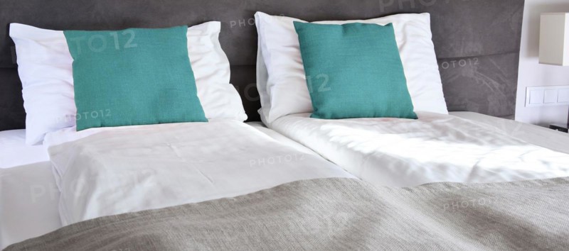 Double bed in hotel room. Accommodation