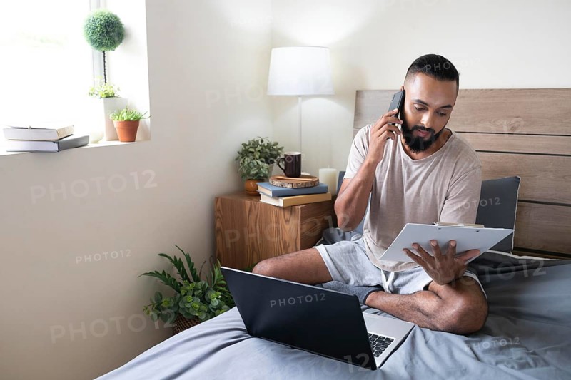 Full shot man working bed