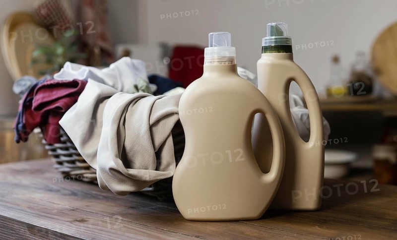 Detergent bottles clothes arrangement. High resolution photo