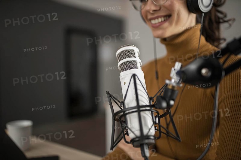 Woman broadcasting radio while smiling. Resolution and high quality beautiful photo