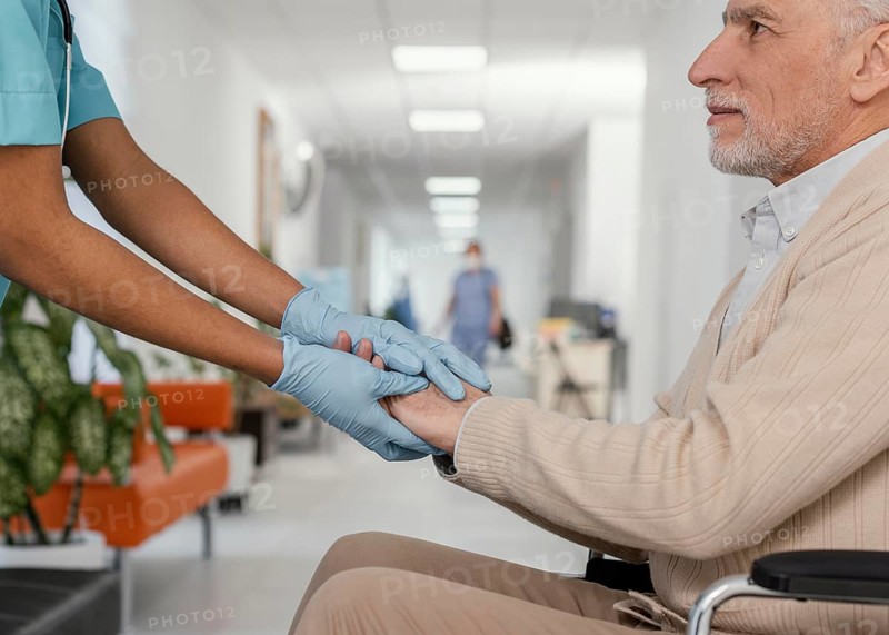 Close up health worker helping patient