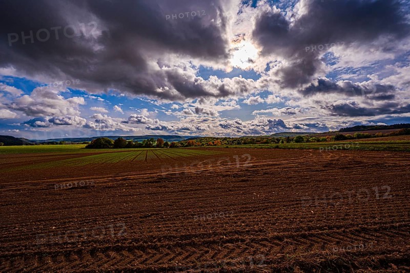 View over the fields of Dornburg towards Jena in autumn with thick rain clouds, Dornburg, Thuringia, Germany, Europe