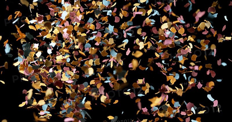 Confettis Falling against Black Background