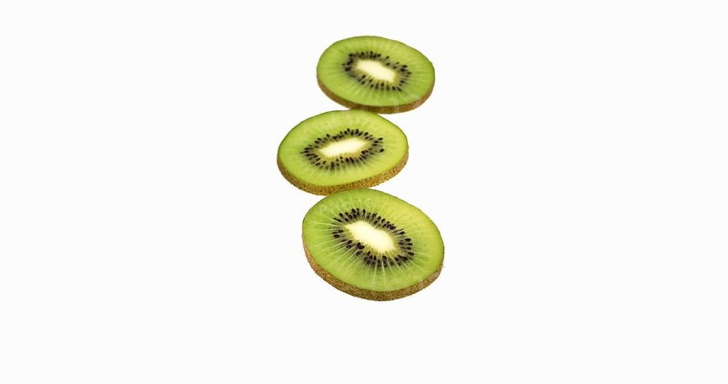 Kiwi (actinidia chinensis), Fruit against White Background
