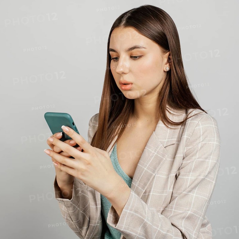 Portrait stylish woman using mobile