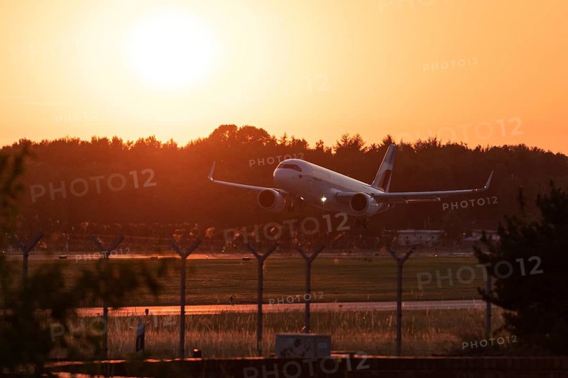 Passenger aircraft Airbus A320neo of the airline Eurowings in the evening glow during approach to Hamburg Airport, Hamburg, Germany, Europe