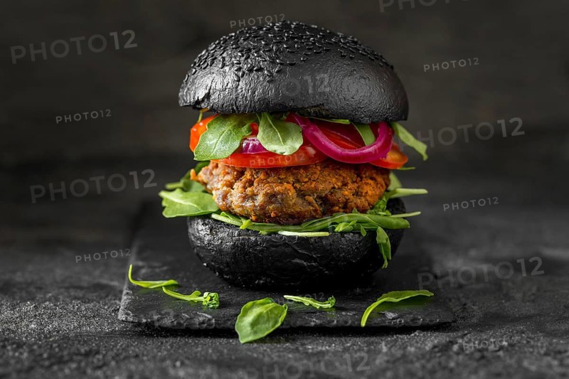 Front view veggie burger with black buns
