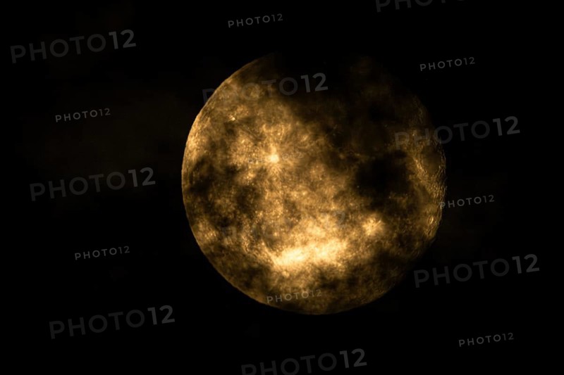 Super moon one day after full moon, moon behind clouds, Braunschweig, Lower Saxony, Germany, Europe