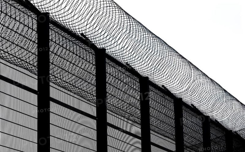 High fence and barbed wire, concertina wire, Nato barbed wire at Mainkofen District Hospital, Deggendorf, Lower Bavaria, Germany, Europe