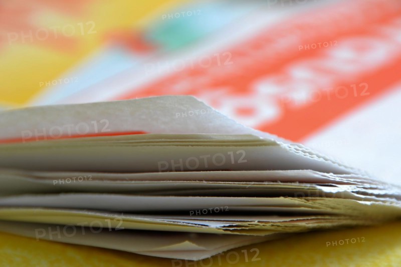 A newspaper lies on a table
