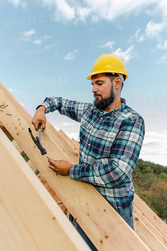 Worker building roof house