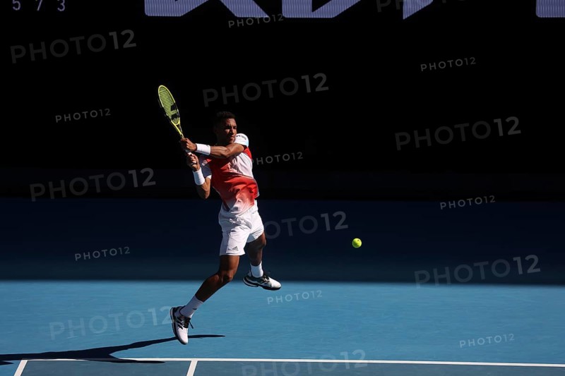 MELBOURNE, AUSTRALIA, JANUARY 24: Felix Auger-Aliassime of Canada on his way to beating Marin Cilic of Croatia on day 8 of the 2022 Australian Open at Melbourne Park on January 24, 2022 in Melbourne, Australia, Oceania