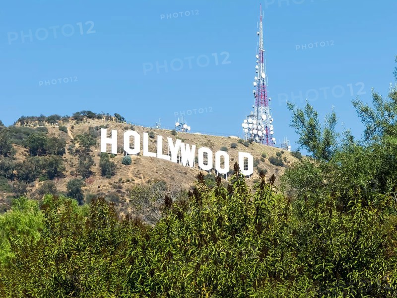 The Hollywood Sign (formerly the Hollywoodland Sign) is a landmark and American cultural icon located in Los Angeles, California. It is situated on Mount Lee in the Hollywood Hills area of the Santa Monica Mountains. The sign overlooks the Hollywood dist