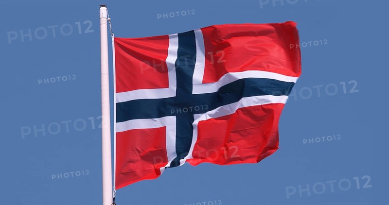 Norwegian Flag Waving in the Wind against blue sky