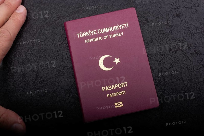 New Turkish passport. Travel, tourism, emigration and passport control concep